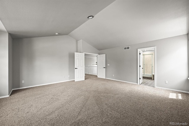2732 Flint Ct, Superior, CO 80027 - unfurnished bedroom featuring carpet, vaulted ceiling, baseboards, and ensuite bathroom