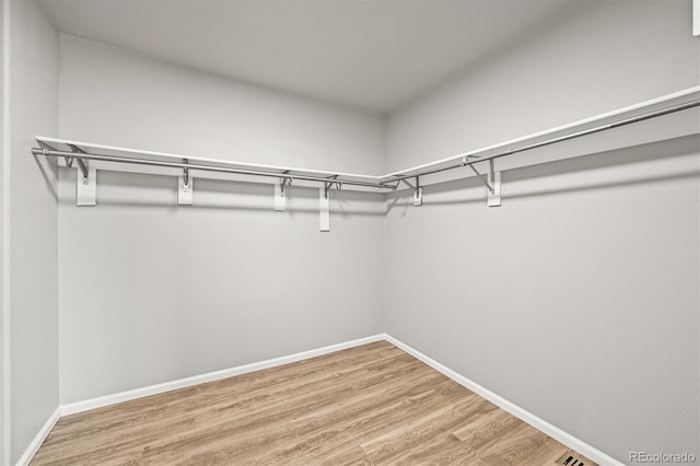 2732 Flint Ct, Superior, CO 80027 - walk in closet featuring wood finished floors