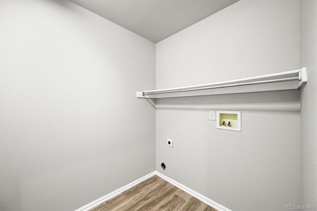 2732 Flint Ct, Superior, CO 80027 - laundry area featuring dark wood-style floors, washer hookup, electric dryer hookup, and baseboards