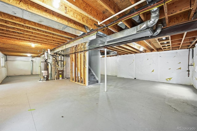 2732 Flint Ct, Superior, CO 80027 - unfinished basement featuring stairs and gas water heater