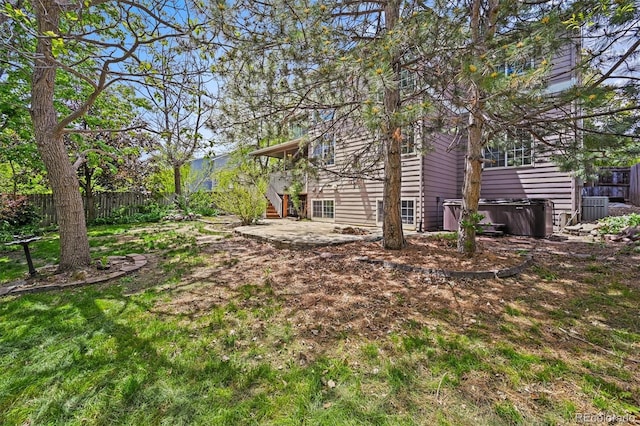 2732 Flint Ct, Superior, CO 80027 - fenced backyard featuring a hot tub, a patio area, stairway, and central air condition unit