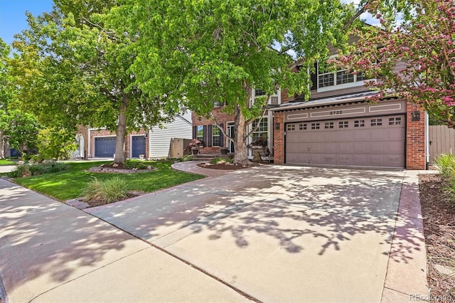 2732 Flint Ct, Superior, CO 80027 - view of property hidden behind natural elements with brick siding, driveway, an attached garage, and a front yard
