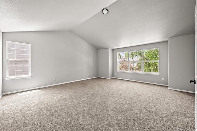 2732 Flint Ct, Superior, CO 80027 - spare room with carpet, vaulted ceiling, and baseboards