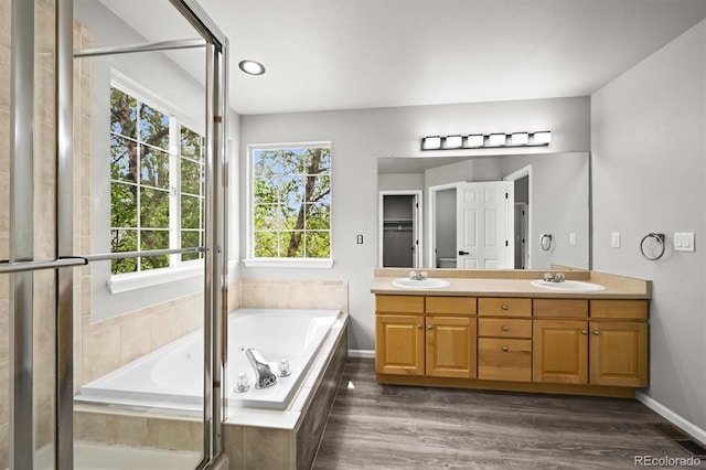 2732 Flint Ct, Superior, CO 80027 - bathroom with healthy amount of natural light, double vanity, a bath, and baseboards