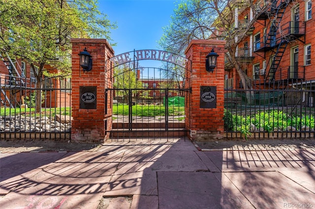 view of gate with fence