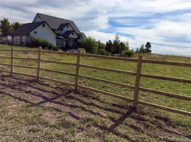 view of yard with a rural view