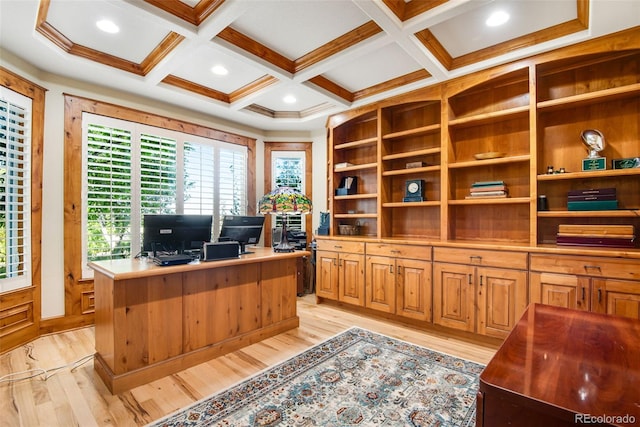 office space featuring coffered ceiling, built in desk, light hardwood / wood-style flooring, and beam ceiling