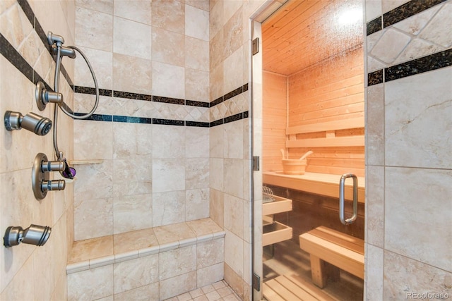 bathroom with a tile shower