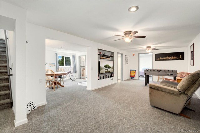 13388 Alcott Cir, Broomfield, CO 80020 - carpeted living room featuring stairs, a ceiling fan, and baseboards