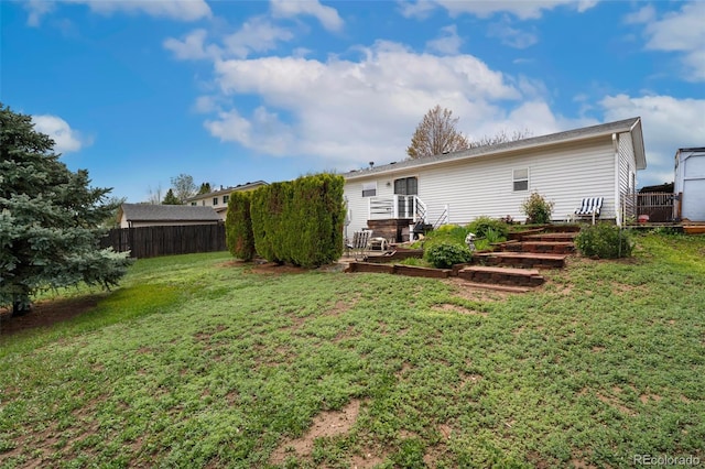 13388 Alcott Cir, Broomfield, CO 80020 - back of property featuring a vegetable garden