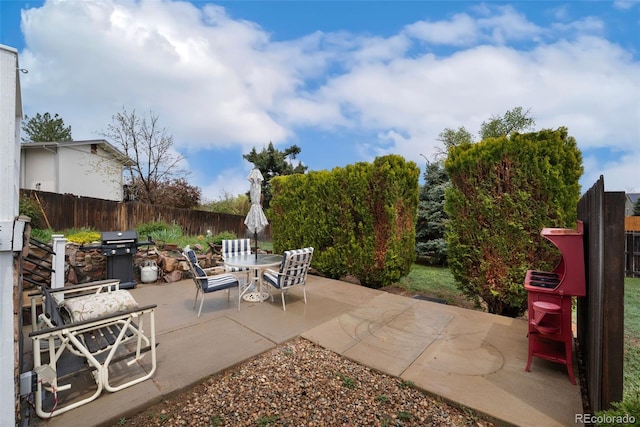 13388 Alcott Cir, Broomfield, CO 80020 - view of patio with grilling area, a fenced backyard, and outdoor dining area