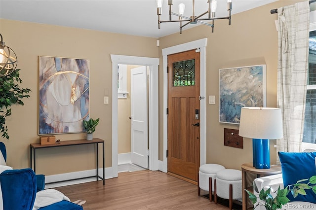 2271 Holly St, Denver, CO 80207 - foyer with a chandelier and wood finished floors