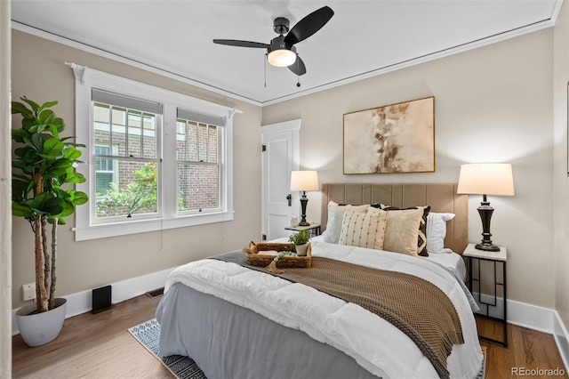 2271 Holly St, Denver, CO 80207 - bedroom with baseboards, wood finished floors, crown molding, and ceiling fan