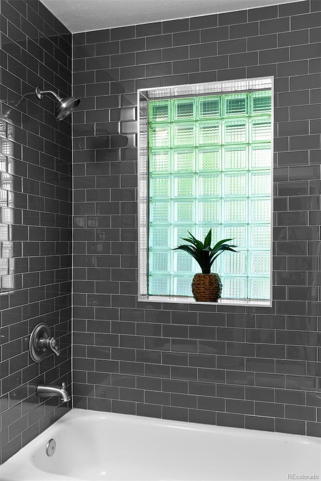 2271 Holly St, Denver, CO 80207 - full bath with shower / bathtub combination and plenty of natural light