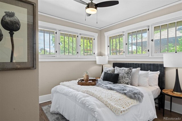 2271 Holly St, Denver, CO 80207 - bedroom featuring baseboards and wood finished floors