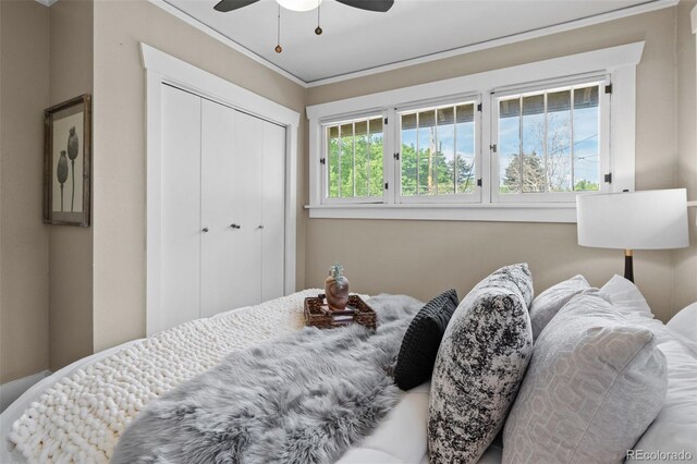 2271 Holly St, Denver, CO 80207 - bedroom with a closet, ornamental molding, and ceiling fan