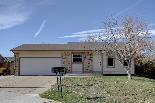 ranch-style home featuring a garage and a front yard