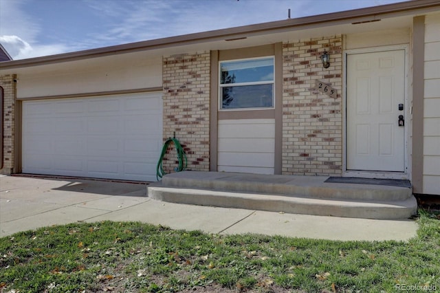 entrance to property featuring a garage