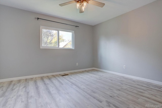 unfurnished room featuring ceiling fan and light hardwood / wood-style flooring