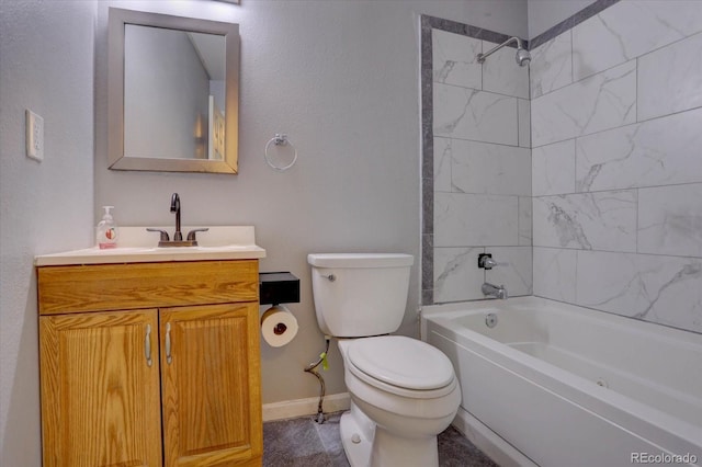 full bathroom featuring vanity, tiled shower / bath combo, and toilet