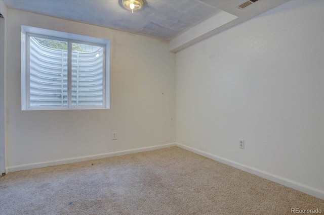 empty room featuring carpet flooring