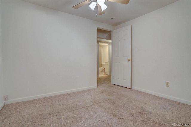 unfurnished room featuring light carpet and ceiling fan