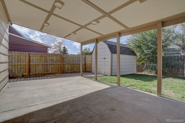 view of patio / terrace with a shed