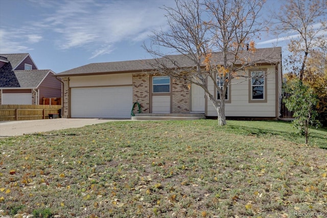 view of front of house featuring a garage and a front yard