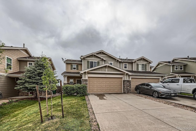 5653 Raleigh Cir, Castle Rock, CO 80104 - view of front of home with a garage, concrete driveway, a front lawn, stone siding, and board and batten siding