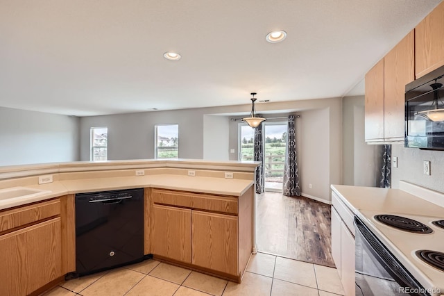 5653 Raleigh Cir, Castle Rock, CO 80104 - kitchen featuring black appliances, light countertops, light tile patterned floors, recessed lighting, and decorative light fixtures