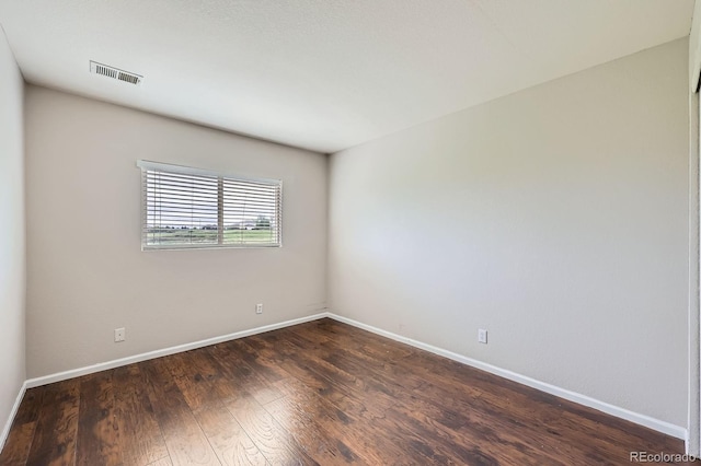 5653 Raleigh Cir, Castle Rock, CO 80104 - unfurnished room with baseboards and dark wood-type flooring