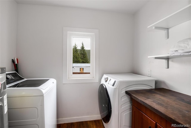 192 Little Creek Rd, Idaho Springs, CO 80452 - laundry area featuring separate washer and dryer, dark wood-type flooring, baseboards, and cabinet space