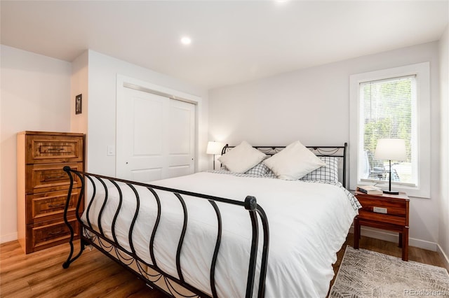 192 Little Creek Rd, Idaho Springs, CO 80452 - bedroom featuring a closet, wood finished floors, baseboards, and recessed lighting