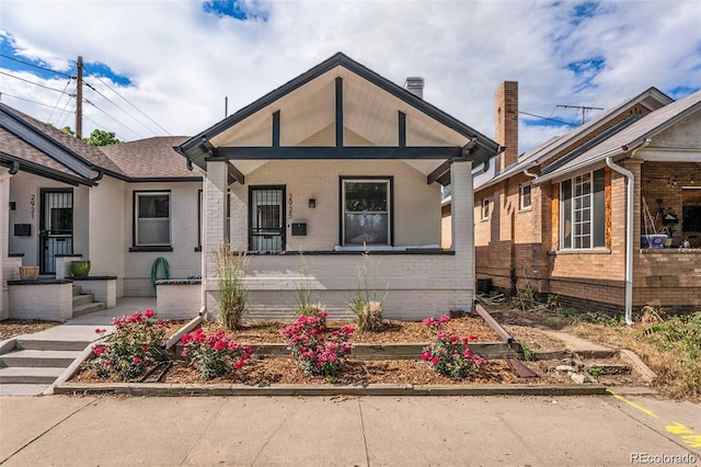 bungalow-style home with brick siding