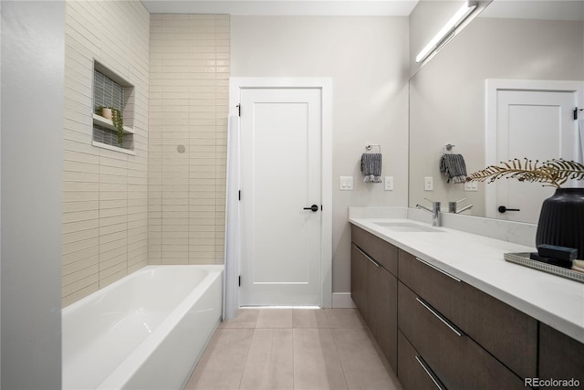 bathroom featuring vanity, baseboards, and tile patterned flooring