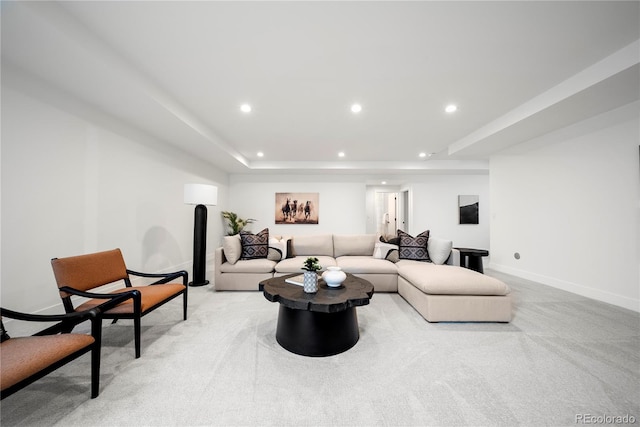 living area with recessed lighting, light colored carpet, and baseboards