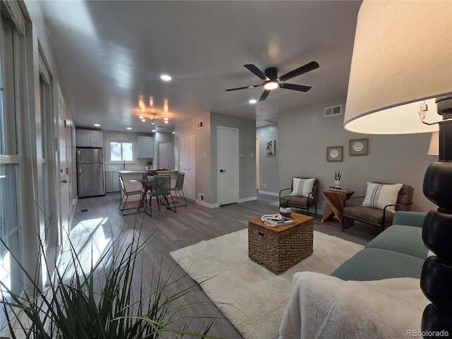 1250 S Monaco Pkwy Unit 17, Denver, CO 80224 - living area with light wood finished floors, a ceiling fan, recessed lighting, and baseboards