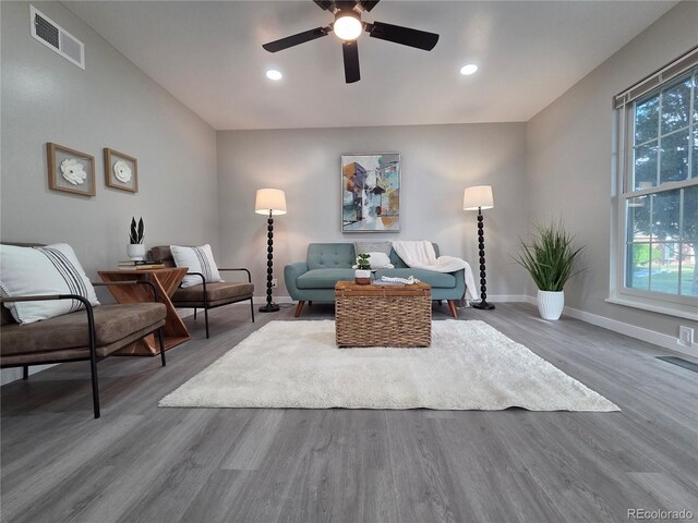1250 S Monaco Pkwy Unit 17, Denver, CO 80224 - living area featuring wood finished floors, plenty of natural light, ceiling fan, baseboards, and recessed lighting