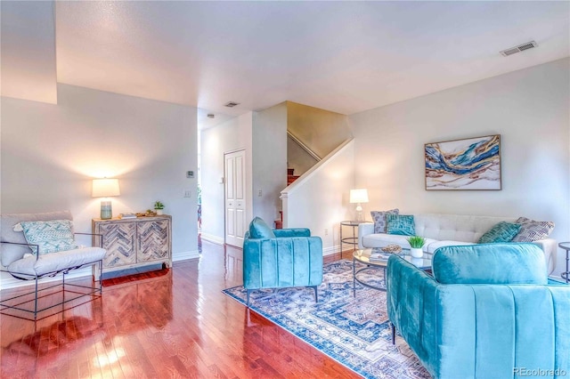 232 W 5th Ave, Denver, CO 80204 - living room featuring visible vents, wood finished floors, baseboards, and stairway