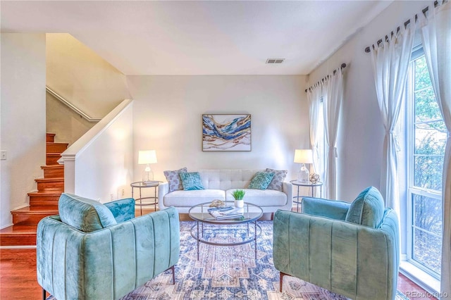 232 W 5th Ave, Denver, CO 80204 - living room featuring stairs, visible vents, plenty of natural light, and wood finished floors