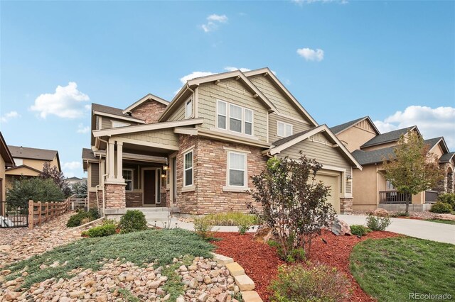 craftsman-style house with a garage and covered porch