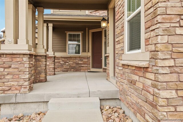 doorway to property featuring a porch