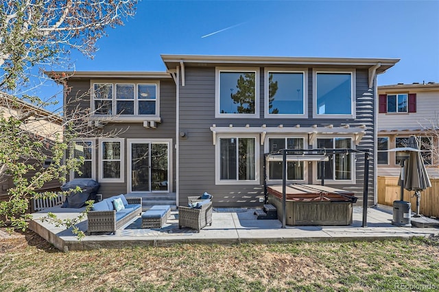 10774 Chadsworth Ln, Highlands Ranch, CO 80126 - back of house with a hot tub and a patio