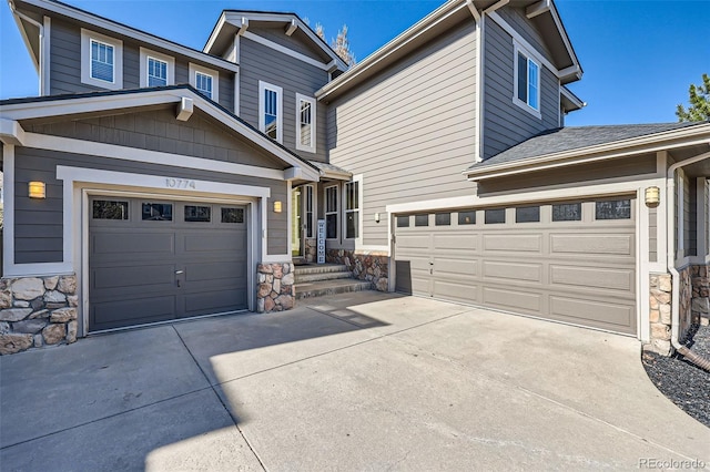 10774 Chadsworth Ln, Highlands Ranch, CO 80126 - view of front of home featuring stone siding, driveway, and roof with shingles