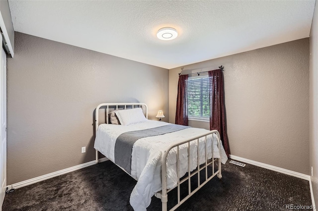 10774 Chadsworth Ln, Highlands Ranch, CO 80126 - carpeted bedroom featuring a textured wall and baseboards