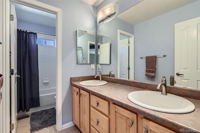 10774 Chadsworth Ln, Highlands Ranch, CO 80126 - bathroom with double vanity, toilet, shower / bath combo with shower curtain, and tile patterned floors