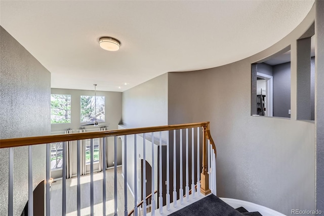 10774 Chadsworth Ln, Highlands Ranch, CO 80126 - corridor with a textured wall, baseboards, and an upstairs landing
