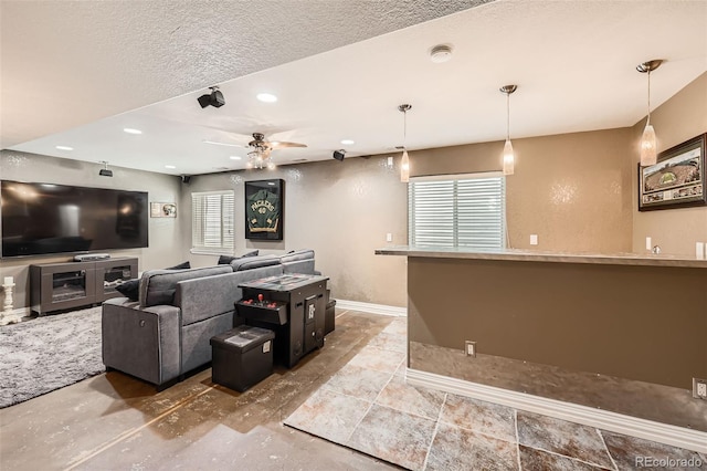 10774 Chadsworth Ln, Highlands Ranch, CO 80126 - living room featuring baseboards, ceiling fan, recessed lighting, and a textured ceiling