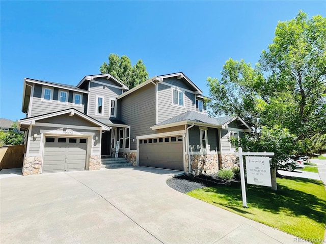 10774 Chadsworth Ln, Highlands Ranch, CO 80126 - view of front of property featuring stone siding, driveway, a garage, and a front yard