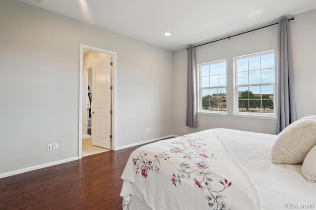 bedroom with baseboards, recessed lighting, and wood finished floors